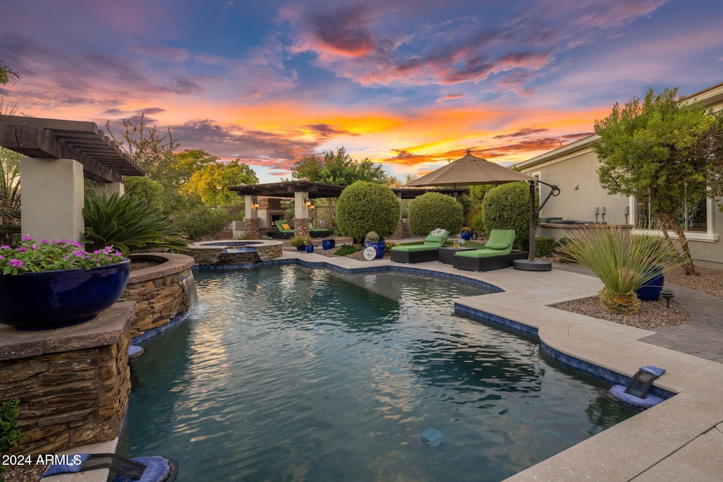 pool at dusk with an in ground hot tub, a gazebo, and a patio area