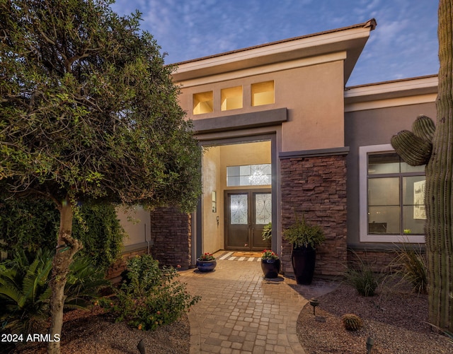 entrance to property with a patio area