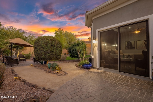 view of patio terrace at dusk