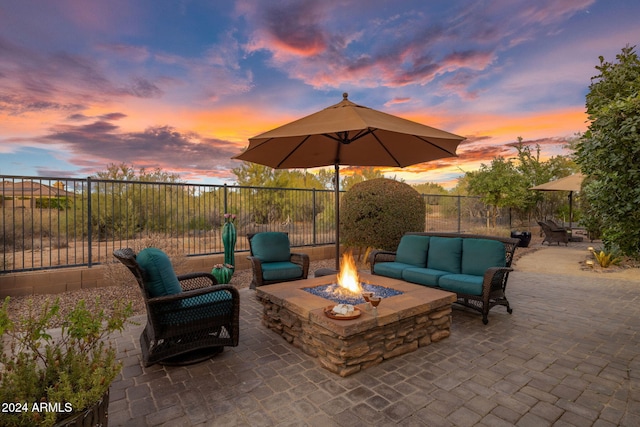 patio terrace at dusk with a fire pit