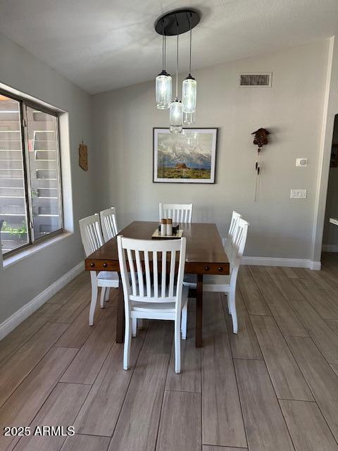 18132 E Vencino St, Gilbert, AZ 85298 - dining area with wood finished floors and baseboards