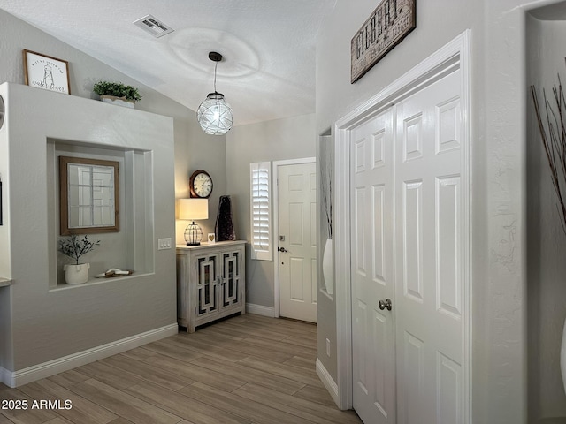 18132 E Vencino St, Gilbert, AZ 85298 - foyer with wood finished floors, baseboards, and a textured ceiling
