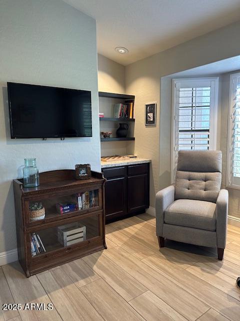 18132 E Vencino St, Gilbert, AZ 85298 - living room featuring light wood finished floors, baseboards, and vaulted ceiling