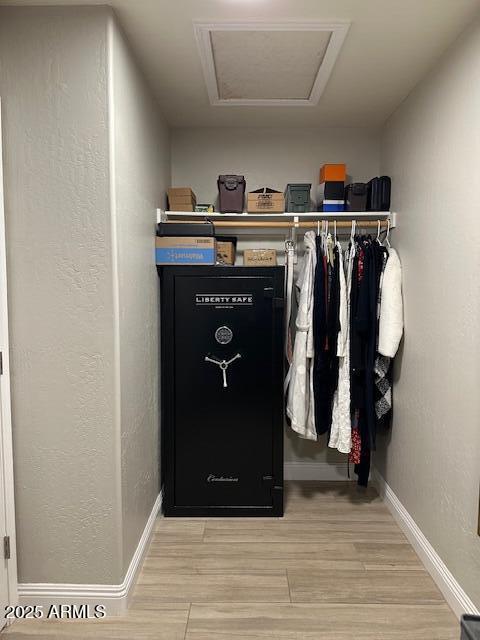18132 E Vencino St, Gilbert, AZ 85298 - spacious closet featuring light wood-type flooring and attic access