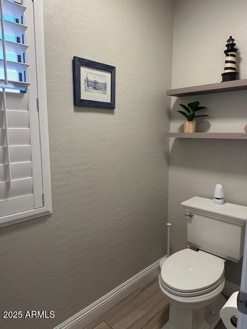 18132 E Vencino St, Gilbert, AZ 85298 - bathroom featuring baseboards, toilet, and wood finished floors