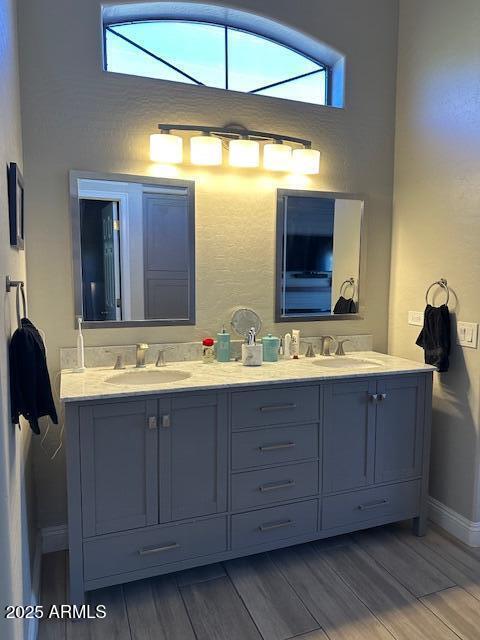 18132 E Vencino St, Gilbert, AZ 85298 - full bath with wood finished floors, baseboards, and double vanity