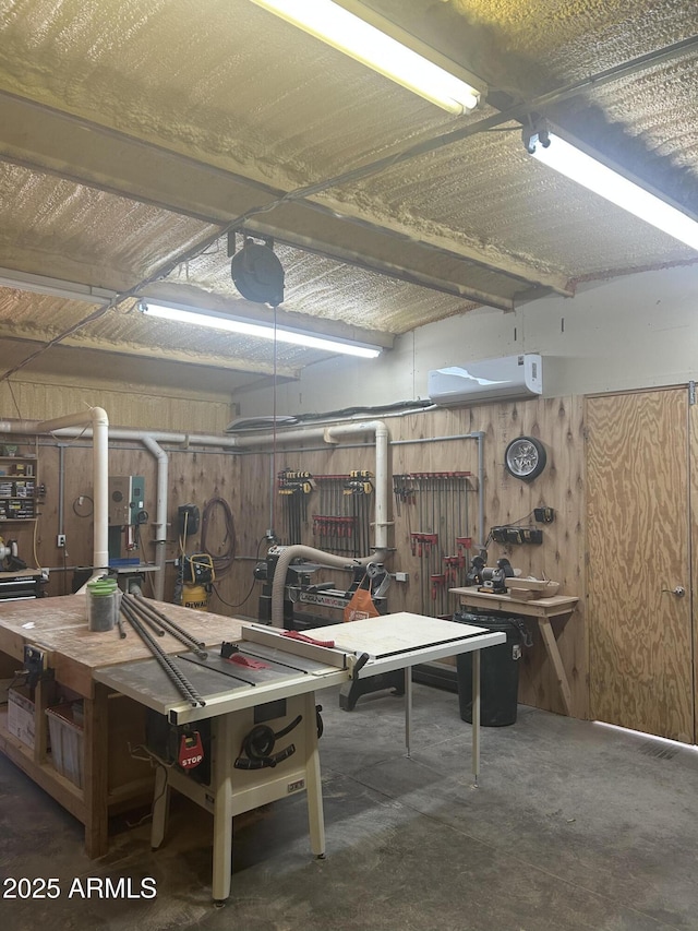 18132 E Vencino St, Gilbert, AZ 85298 - garage featuring a workshop area and wood walls