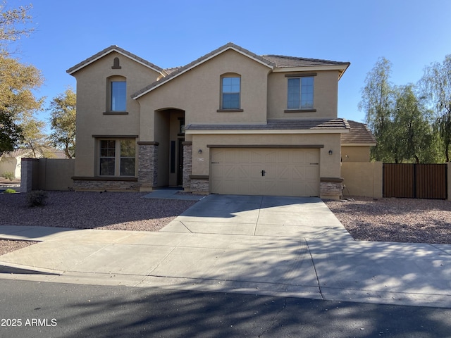 view of front of property featuring fence, driveway, stucco siding, a garage, and a tiled roof