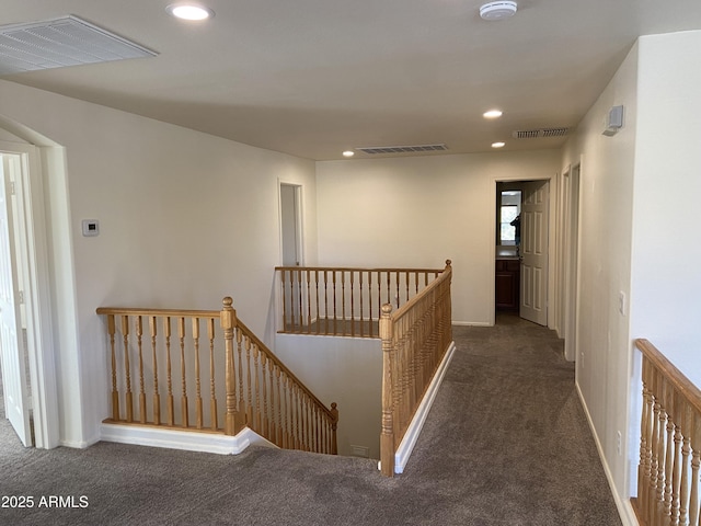 corridor featuring recessed lighting, an upstairs landing, and visible vents