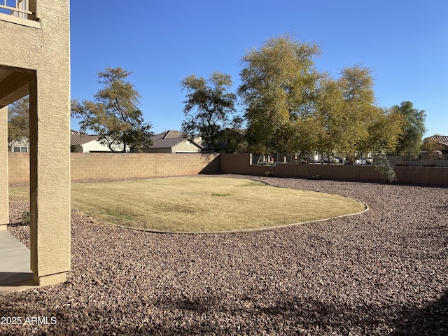 view of yard with a fenced backyard