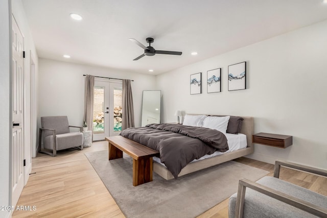 bedroom featuring light wood-type flooring, french doors, access to outside, and recessed lighting