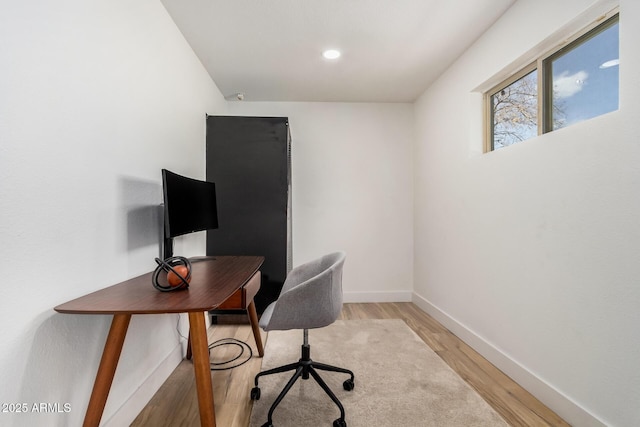 office with light wood finished floors, baseboards, and recessed lighting