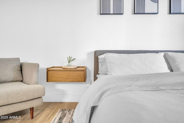 bedroom with wood finished floors