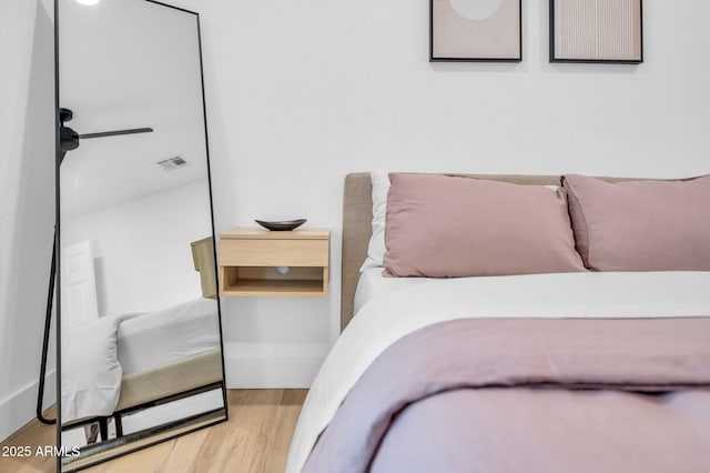 bedroom with wood finished floors