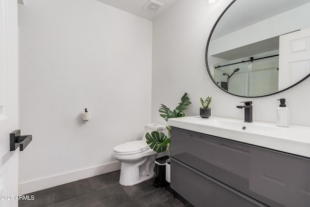 bathroom with visible vents, baseboards, toilet, vanity, and a shower stall