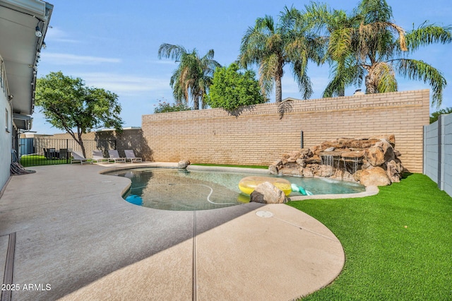 view of pool with a patio area, a fenced backyard, a fenced in pool, and a lawn