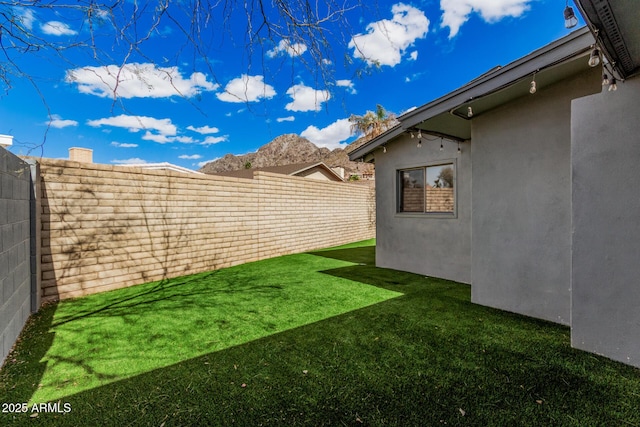 view of yard with a fenced backyard