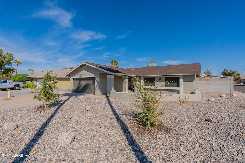 ranch-style home with a garage