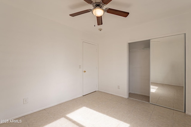 unfurnished bedroom featuring a closet and ceiling fan