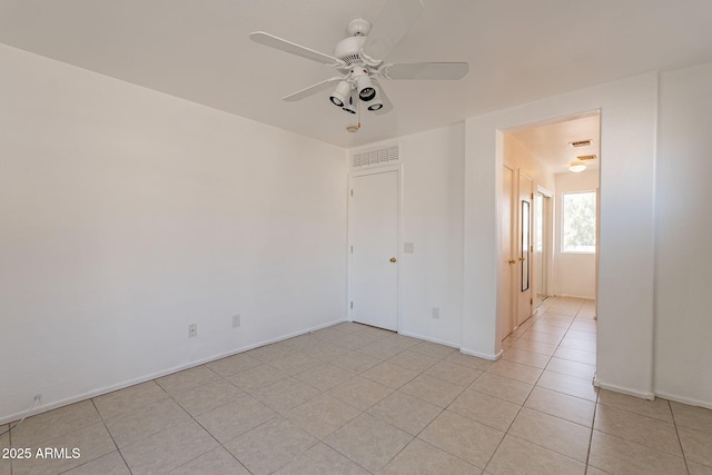 unfurnished bedroom with ceiling fan and light tile patterned flooring