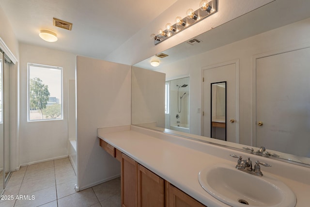 bathroom featuring tile patterned flooring, vanity, and independent shower and bath