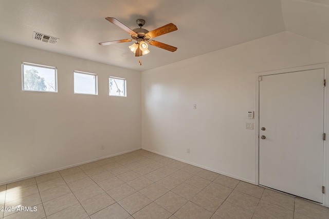 spare room featuring light tile patterned floors and ceiling fan