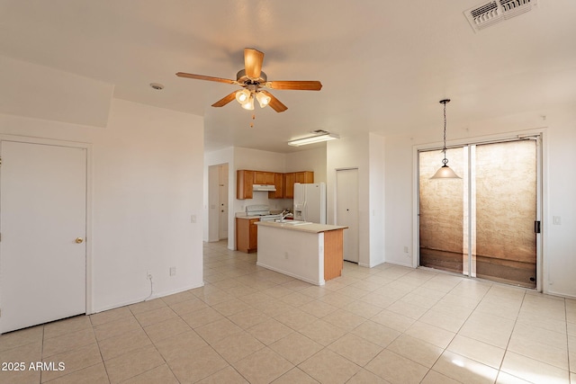 kitchen with electric range oven, light tile patterned floors, white fridge with ice dispenser, pendant lighting, and ceiling fan