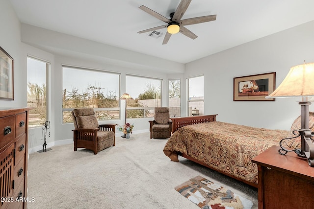 bedroom with light carpet and ceiling fan