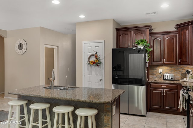 7715 S 69th Ln, Laveen, AZ 85339 - kitchen featuring decorative backsplash, stone countertops, and stainless steel appliances