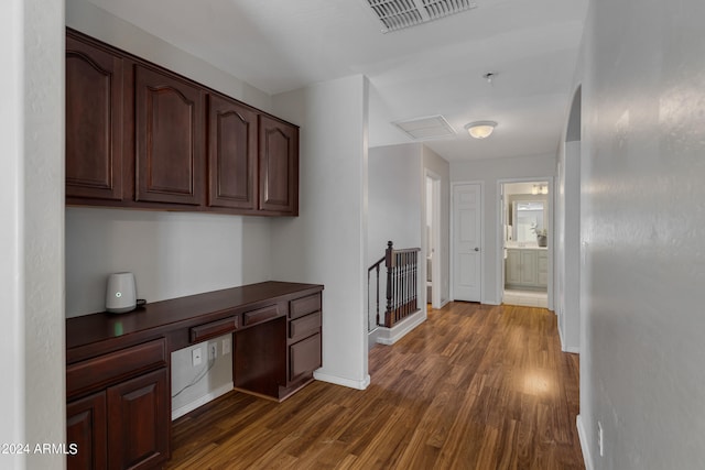 hallway with dark hardwood / wood-style floors