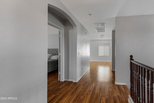 hallway featuring dark hardwood / wood-style flooring