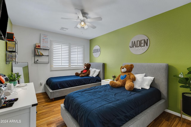 bedroom featuring hardwood / wood-style floors and ceiling fan