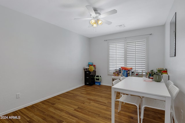 office area with ceiling fan and wood-type flooring