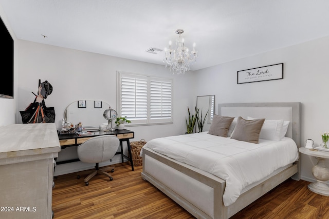 7715 S 69th Ln, Laveen, AZ 85339 - bedroom with visible vents, a notable chandelier, and wood finished floors