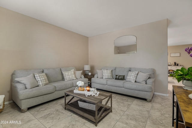 living room with light tile patterned flooring