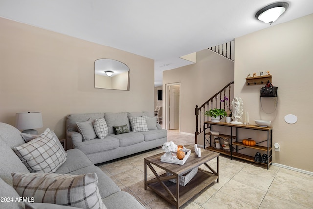 7715 S 69th Ln, Laveen, AZ 85339 - living room with baseboards, stairway, and light tile patterned floors
