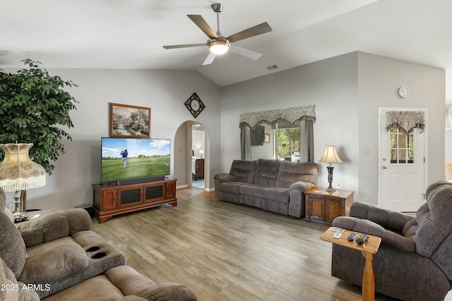 111 S Forest Park Dr, Payson, AZ 85541 - living area with arched walkways, light wood-style flooring, visible vents, and ceiling fan
