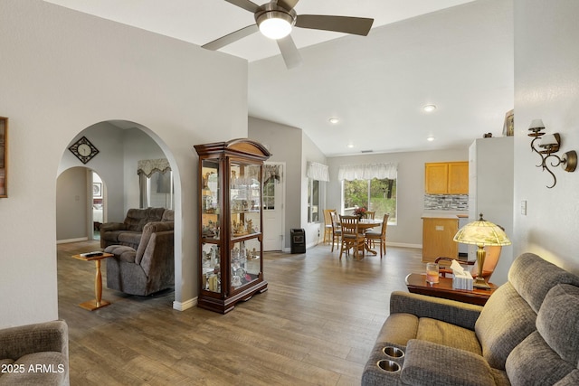 111 S Forest Park Dr, Payson, AZ 85541 - living area featuring baseboards, arched walkways, light wood-type flooring, a ceiling fan, and vaulted ceiling