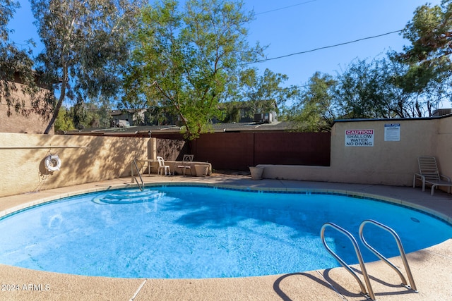 view of swimming pool featuring a patio