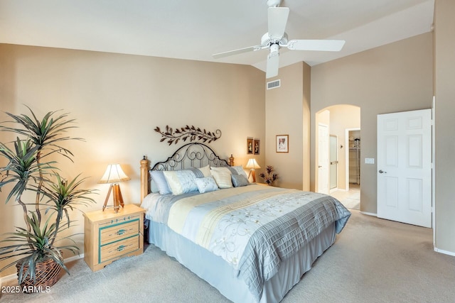 carpeted bedroom featuring high vaulted ceiling and ceiling fan