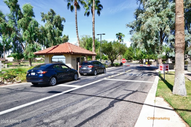 view of street with traffic signs and curbs