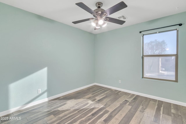 unfurnished room with ceiling fan and wood-type flooring