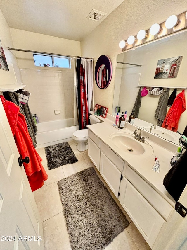 full bathroom with tile patterned flooring, vanity, shower / bath combo, and toilet