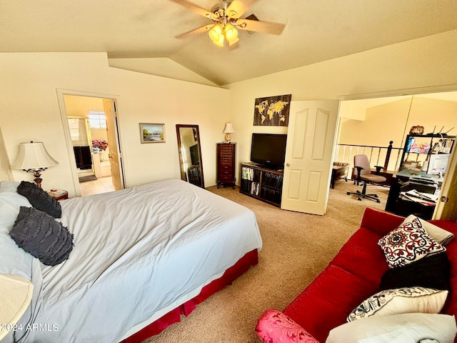 carpeted bedroom featuring connected bathroom, vaulted ceiling, and ceiling fan