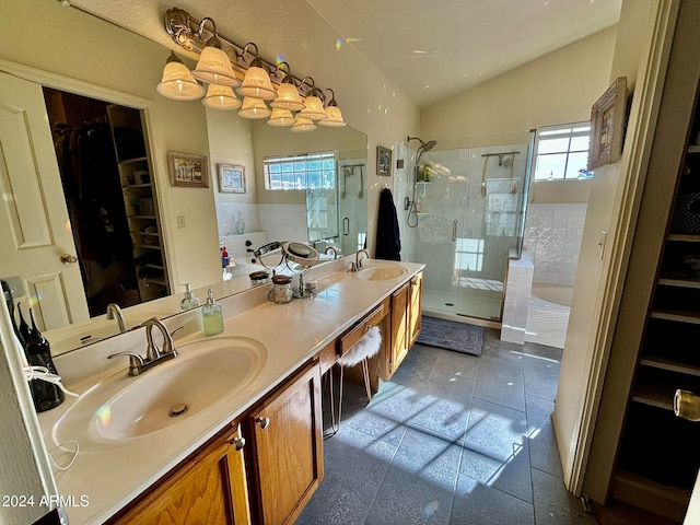 bathroom with separate shower and tub, a wealth of natural light, tile patterned floors, and vanity