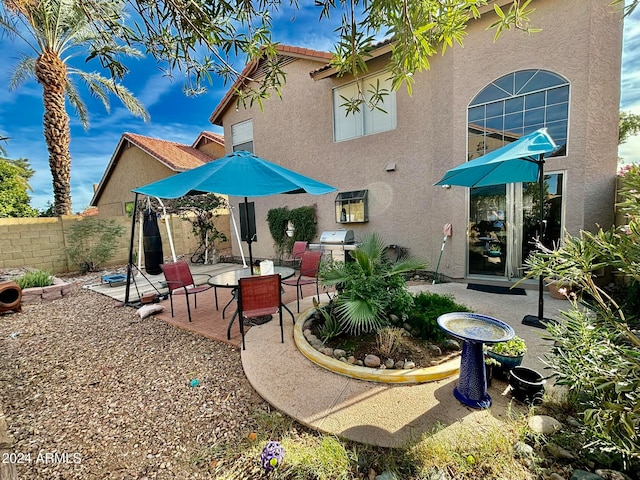 rear view of house with a patio