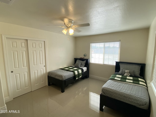 bedroom featuring a closet and ceiling fan