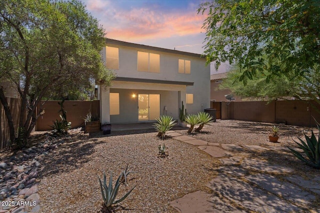 180 S 18th St, Coolidge, AZ 85128 - back of house with stucco siding, a fenced backyard, and a patio