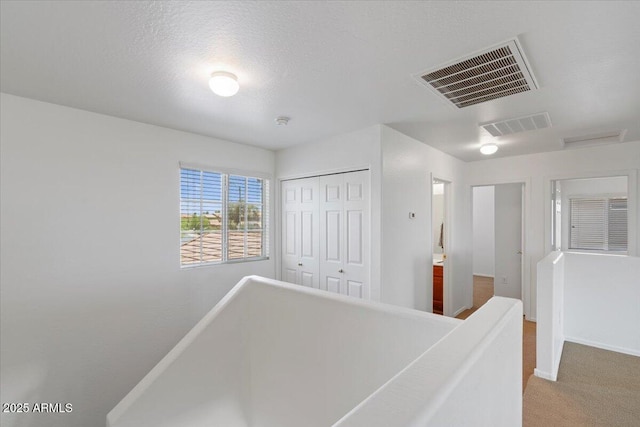 180 S 18th St, Coolidge, AZ 85128 - hallway featuring an upstairs landing, carpet flooring, and baseboards