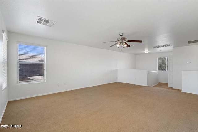 180 S 18th St, Coolidge, AZ 85128 - unfurnished room with light colored carpet, ceiling fan, and baseboards